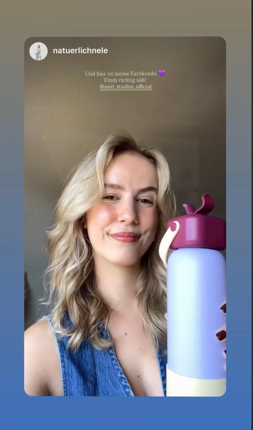 Holding a lilac and pink nori bottle