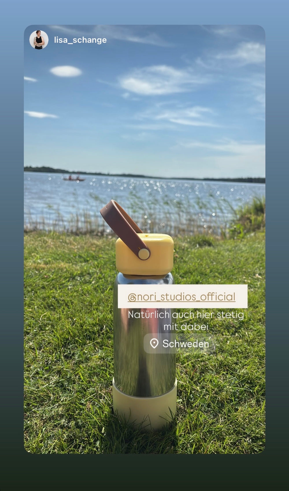 Olive nori bottle with a wooden cap, down by the water