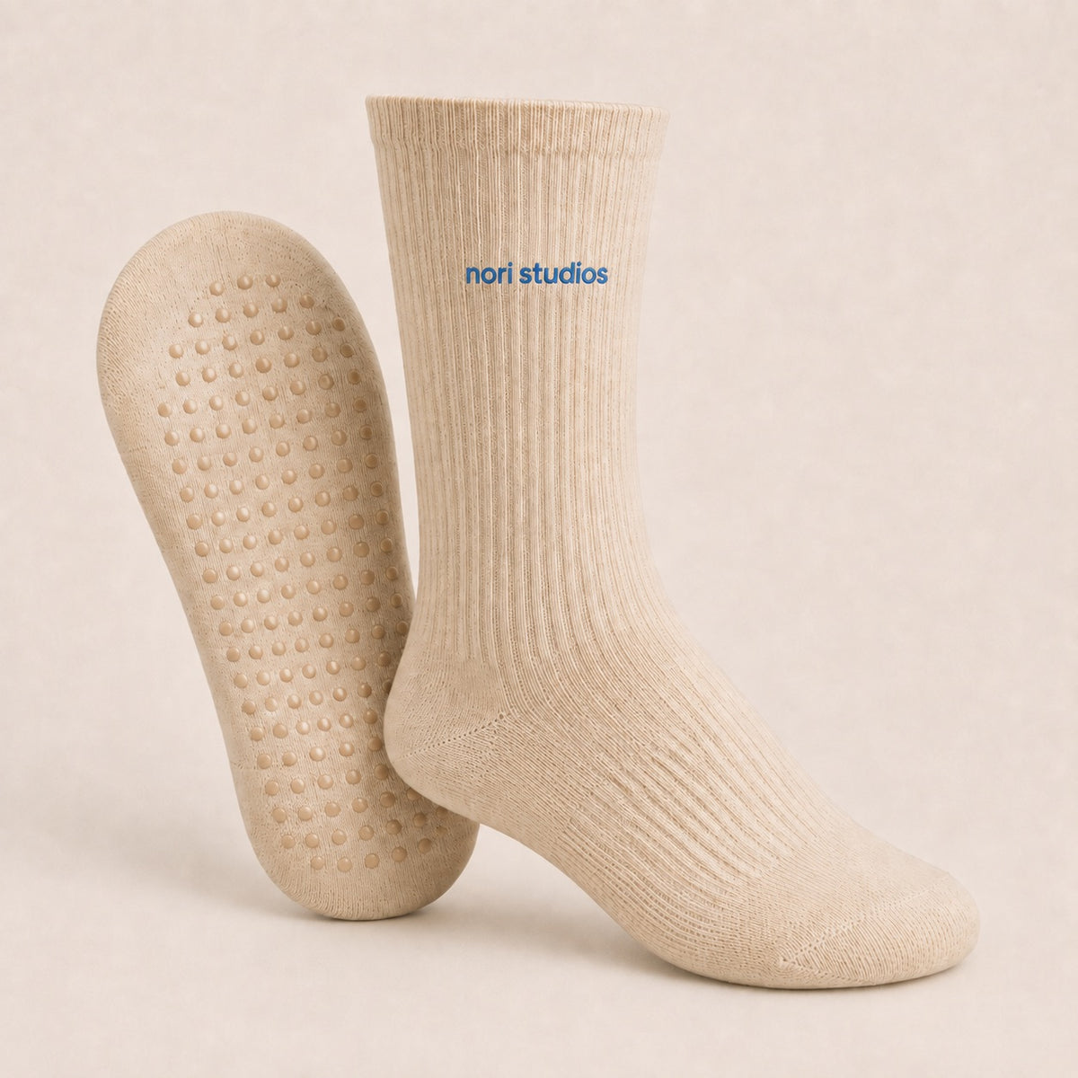 Oat ribbed nori studios crew socks, with grip dots across the sole